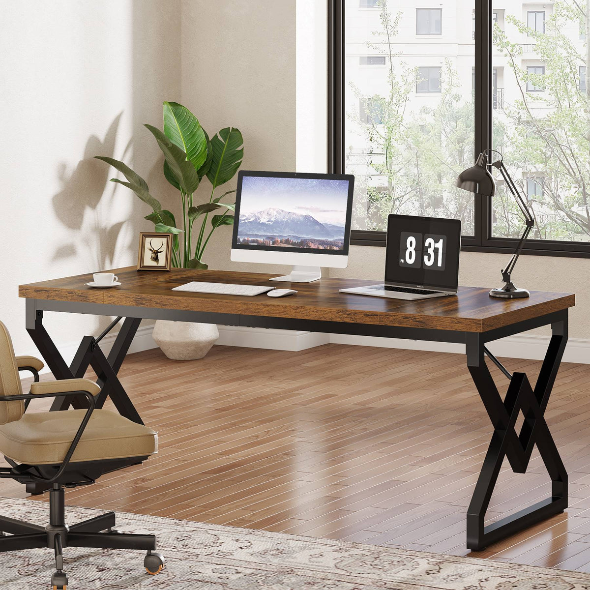 Vintage brown computer desk with a monitor and clock by a bright window