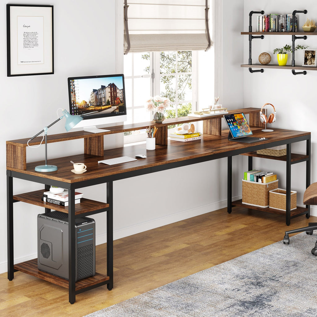 One end of the desk in use with a desktop tower on the lower open shelf