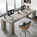Stowena 86 inch two person desk in gray with dual monitors and an office chair
