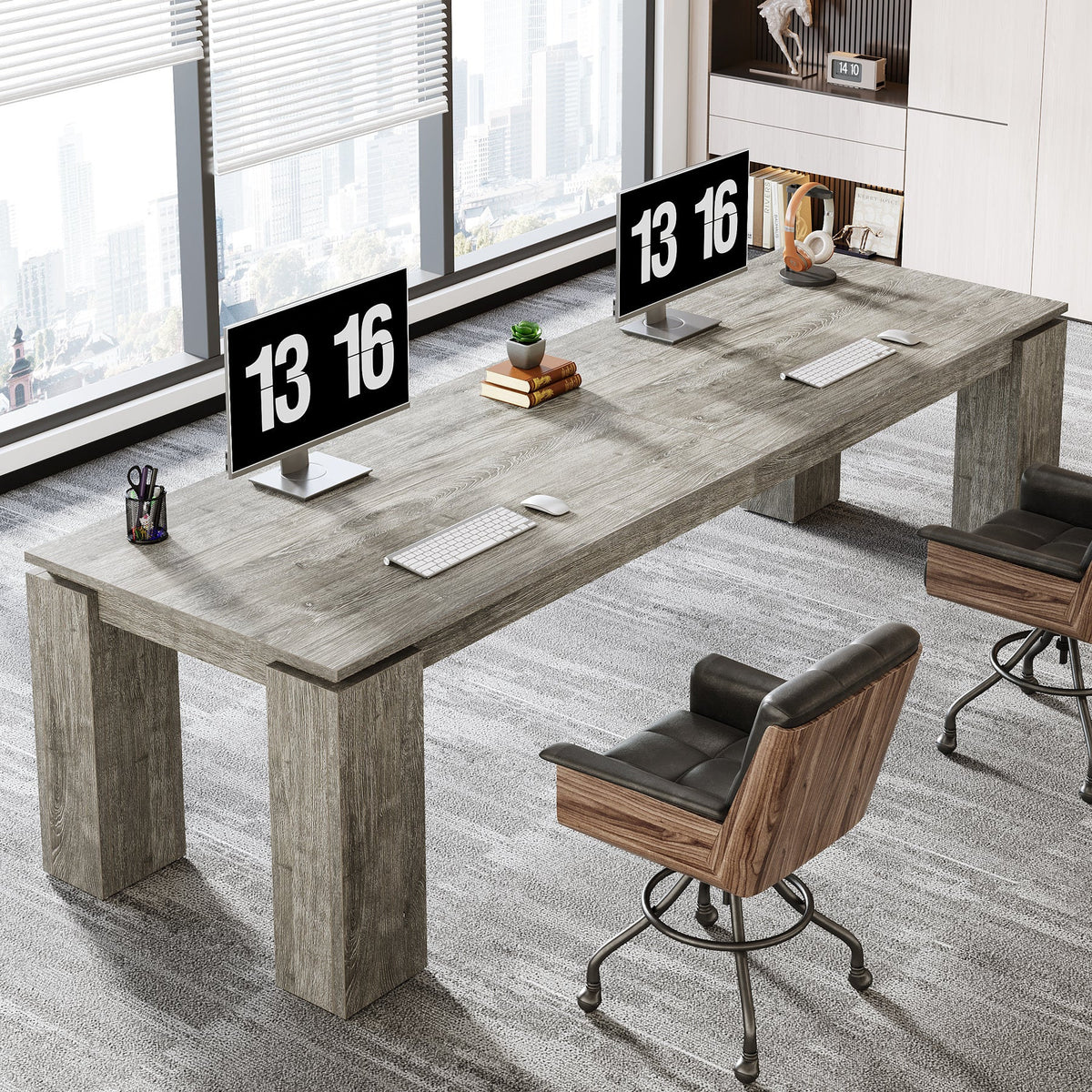 Stowena 86 inch two person desk in gray with dual monitors and an office chair