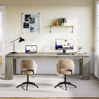 Two person desk with lamp and pinboard wall in a home office