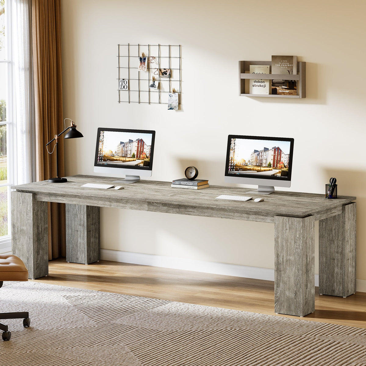 Dual workstation desk under wall shelves with monitors and decor