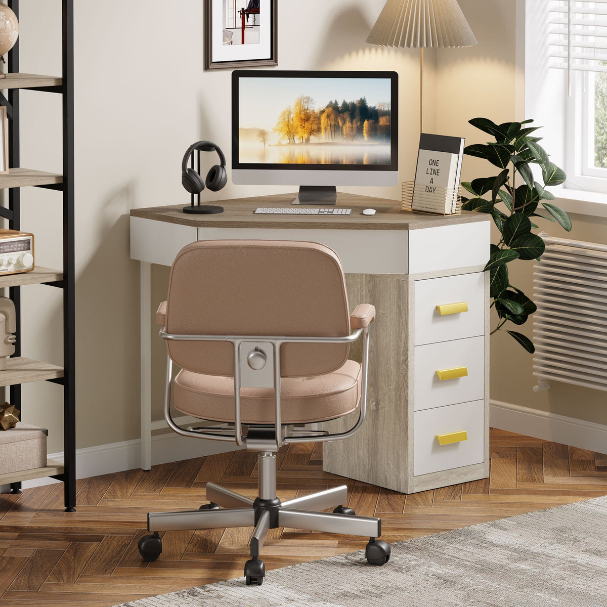 Gray and white corner desk with a monitor and headphones in a home office