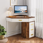 Corner desk styled with a lamp and monitor against a green wall