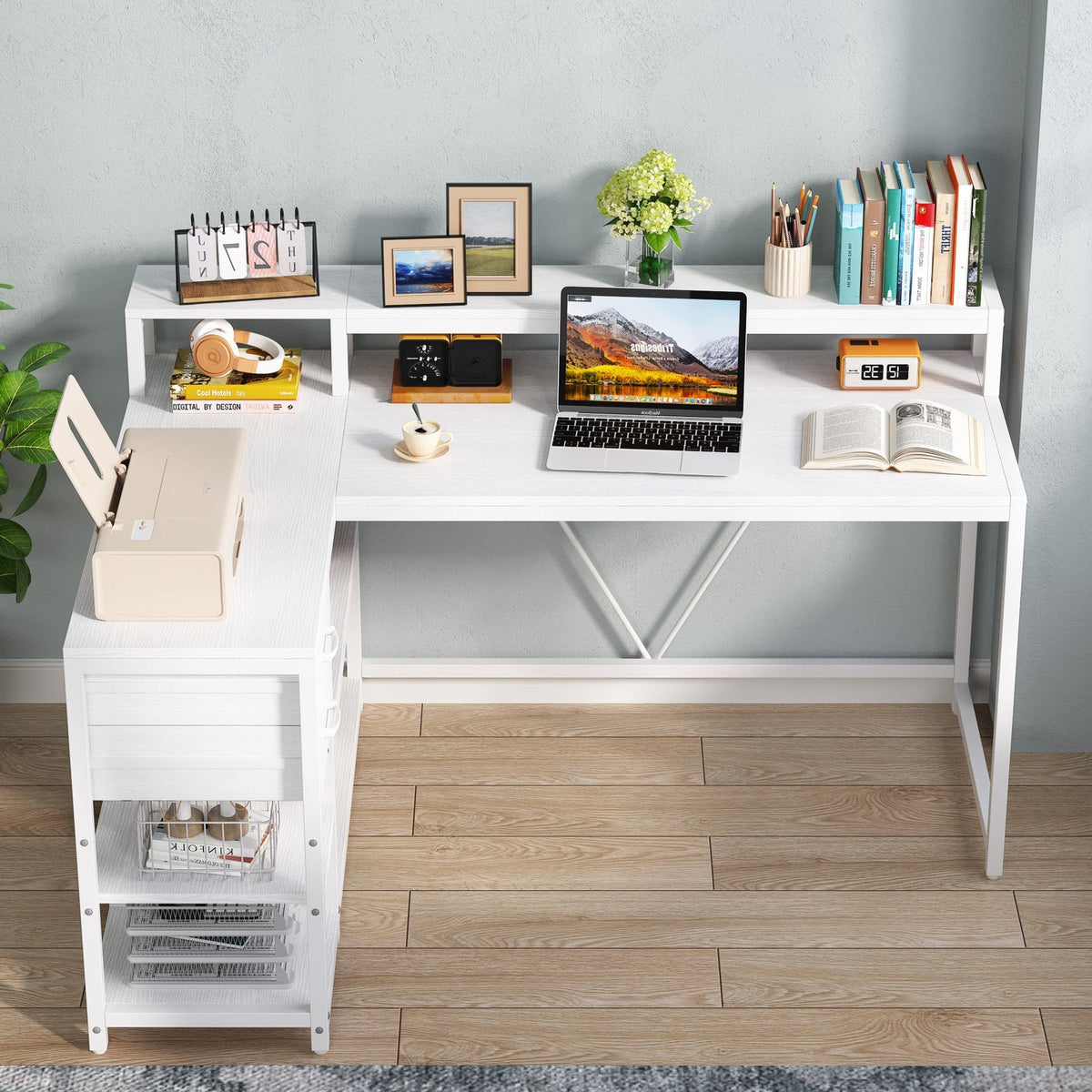 White corner desk with books and a monitor on the raised stand