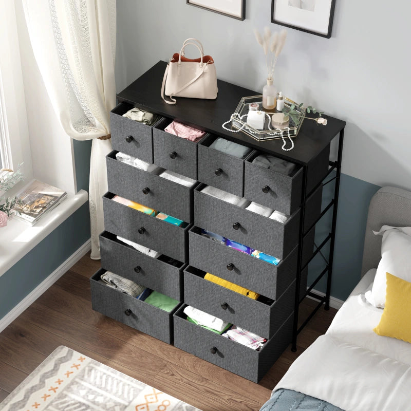 The dresser beside a bed with the drawers open showing clothes sorted by drawer