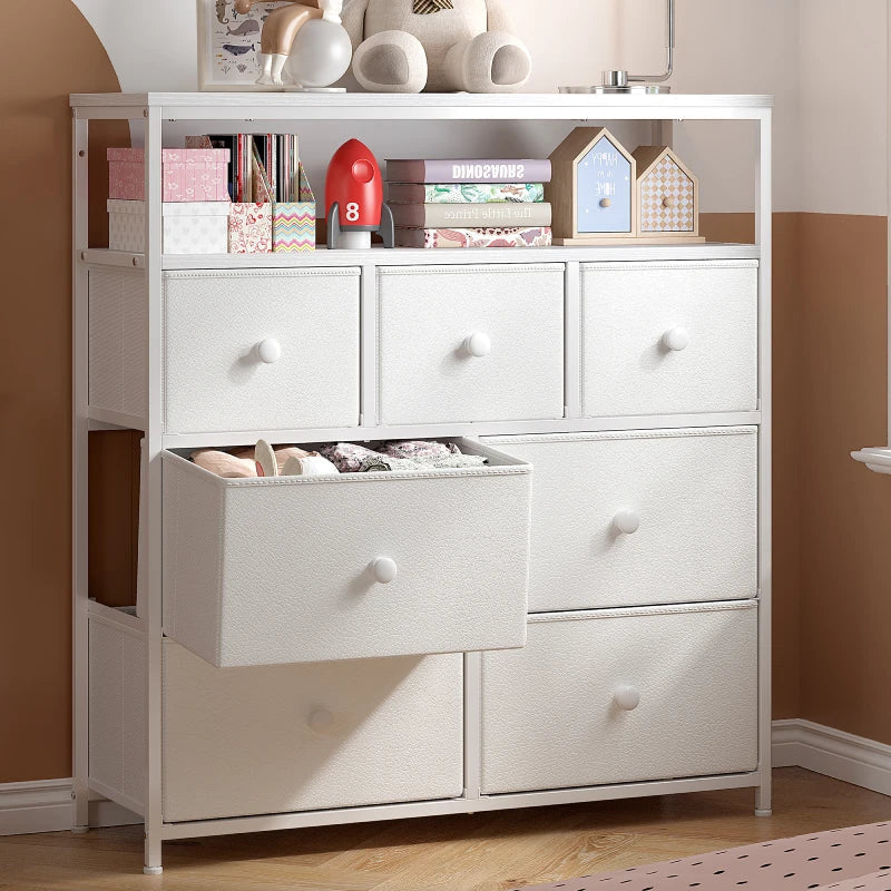 The dresser with one large fabric drawer pulled out showing folded clothes inside