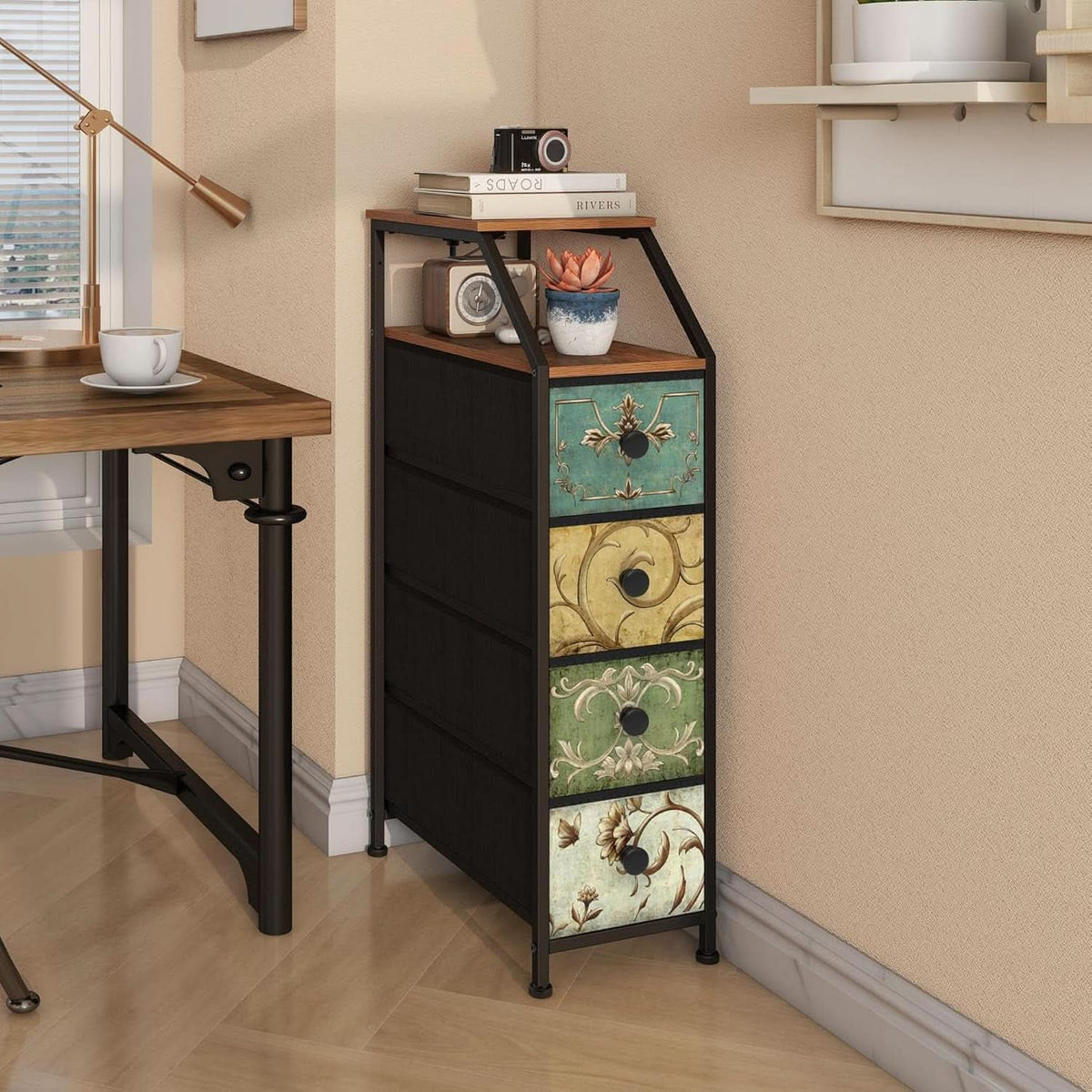 Floral drawer tower beside a desk holding books and a coffee cup