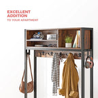 Hall tree top section in an apartment entryway with bags and a coat on the hooks and books and decor on the upper shelf