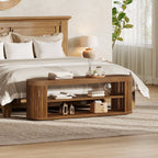 End of bed bench in a bedroom with decor on the shelves