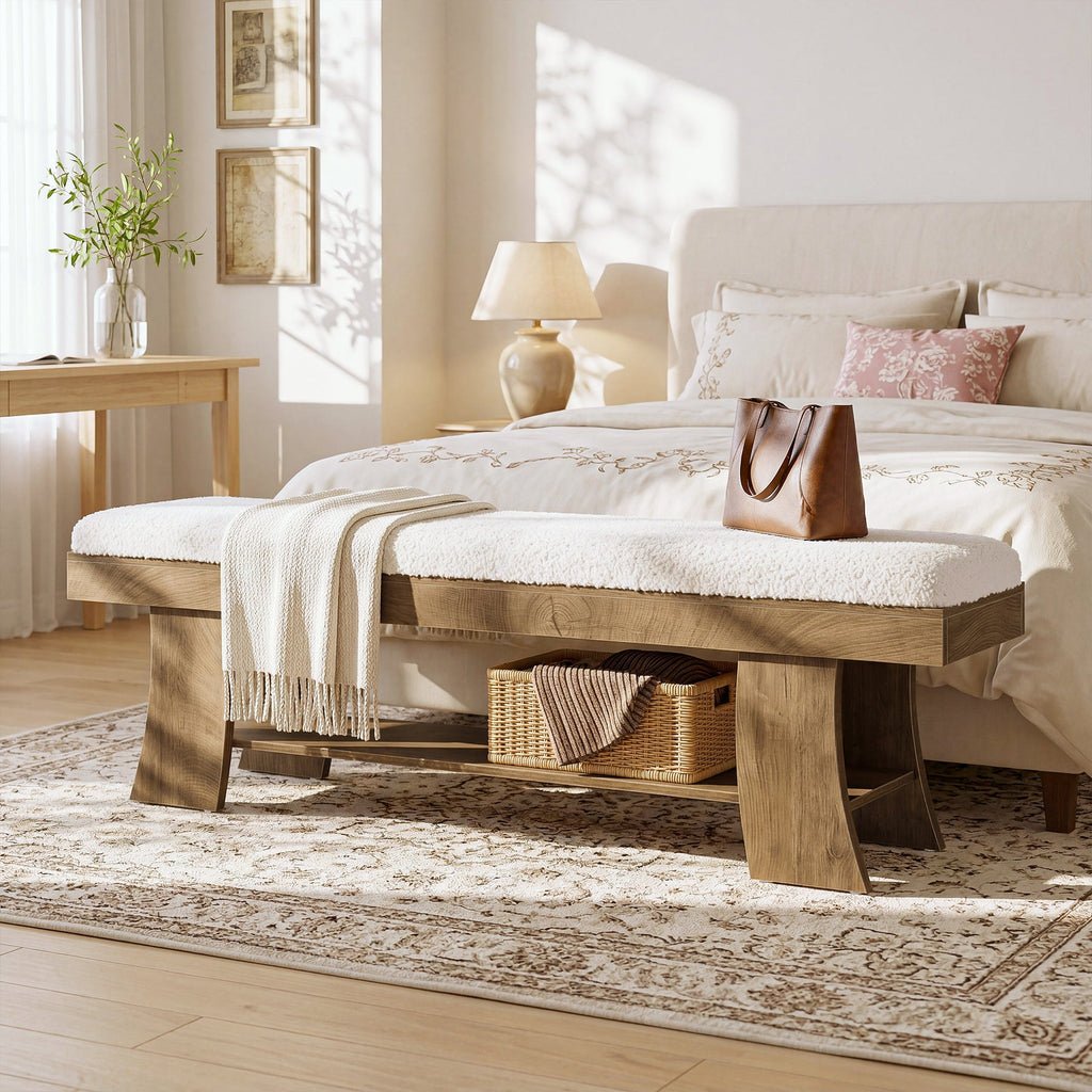 Upholstered bench at the end of a bed with a bag and basket below