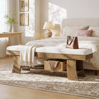 Upholstered bench at the end of a bed with a bag and basket below