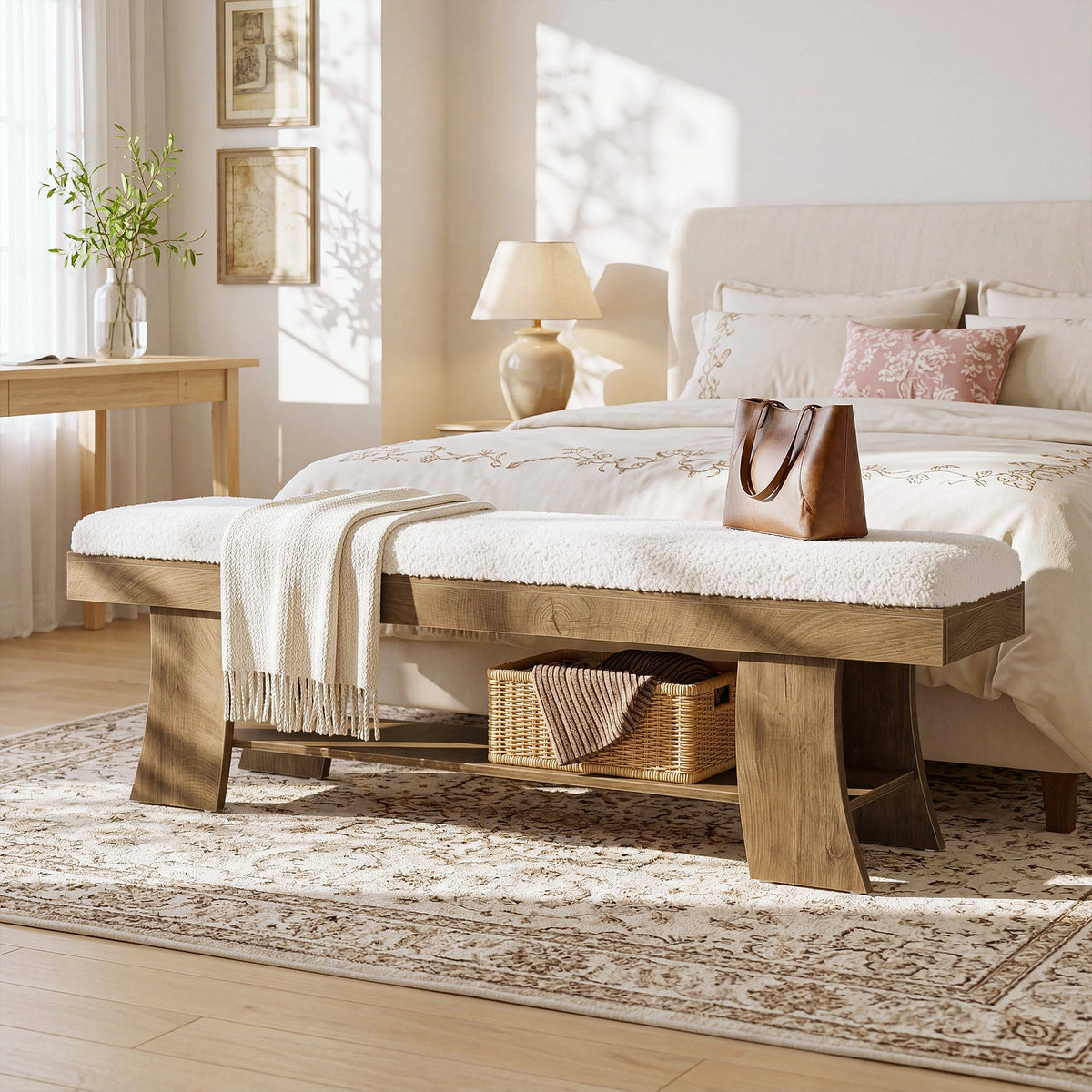 Upholstered bench at the end of a bed with a bag and basket below