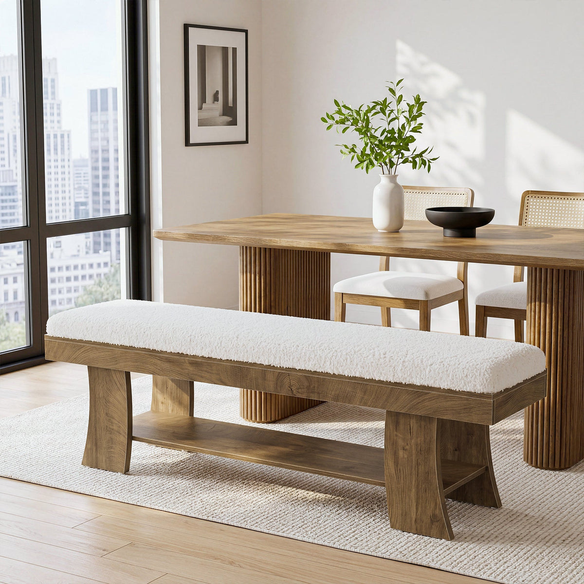 White cushioned bench at a dining table by a window