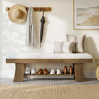 Entryway bench under a coat rail with shoes on the open shelf