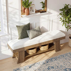 Bench styled below a wall shelf with pillows on the cushion