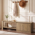 Stowena 63 inch shoe bench with cabinet under a coat rack in a panelled entry