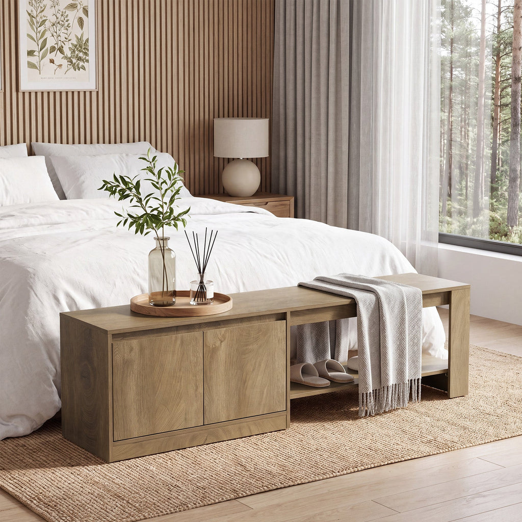 Bench at the foot of a bed with a tray and throw on the seat