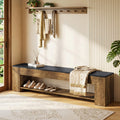 Stowena 71 inch entryway bench with black top and shoe shelf under a coat rack with hanging clothes