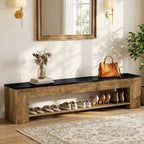 Long two tone shoe bench below a mirror holding shoes on its lower shelf