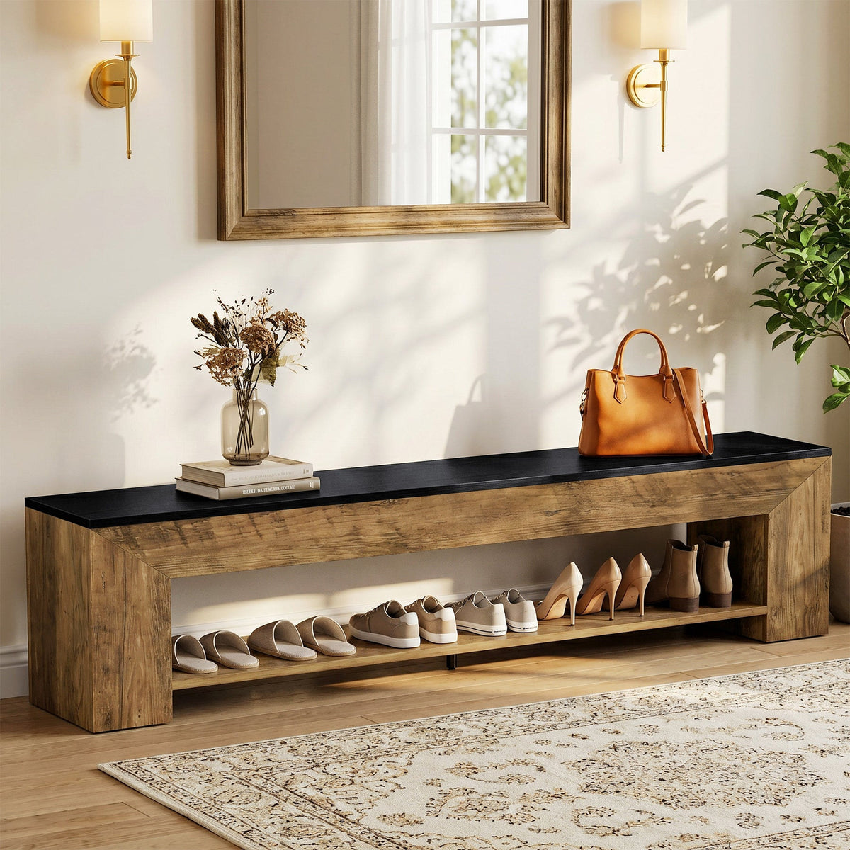 Long two tone shoe bench below a mirror holding shoes on its lower shelf