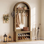 Arched hall tree with lanterns and shoe rows in a bright entryway