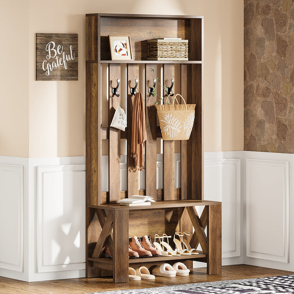 Stowena 70.8 inch hall tree in rustic brown with coats on hooks and shoes on the bench shelf