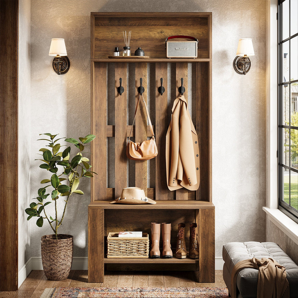 Hall tree with coat, hat and boots in a warm-lit entryway with an umbrella stand