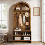 Rustic brown hall tree with baskets on the arched top shelf