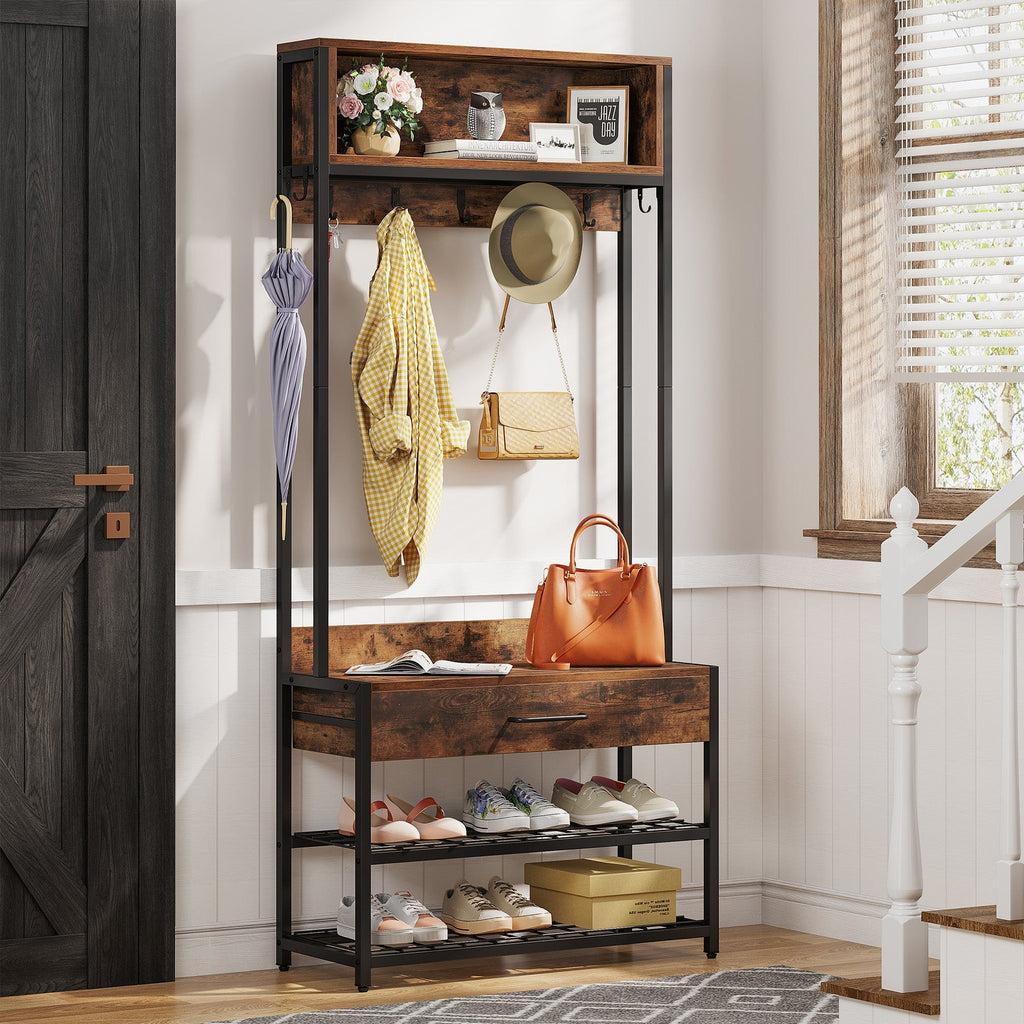 Rustic hall tree with hung jackets, bag on the seat and shoes below by a barn door