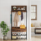 Hall tree in a bright living room entry with coats and a handbag