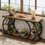 Three tier C table styled with plants and baskets against a wall