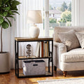 Stowena narrow rustic brown end table beside a sofa holding a lamp and books