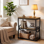 Narrow side table holding a lamp, blanket and basket beside a chair