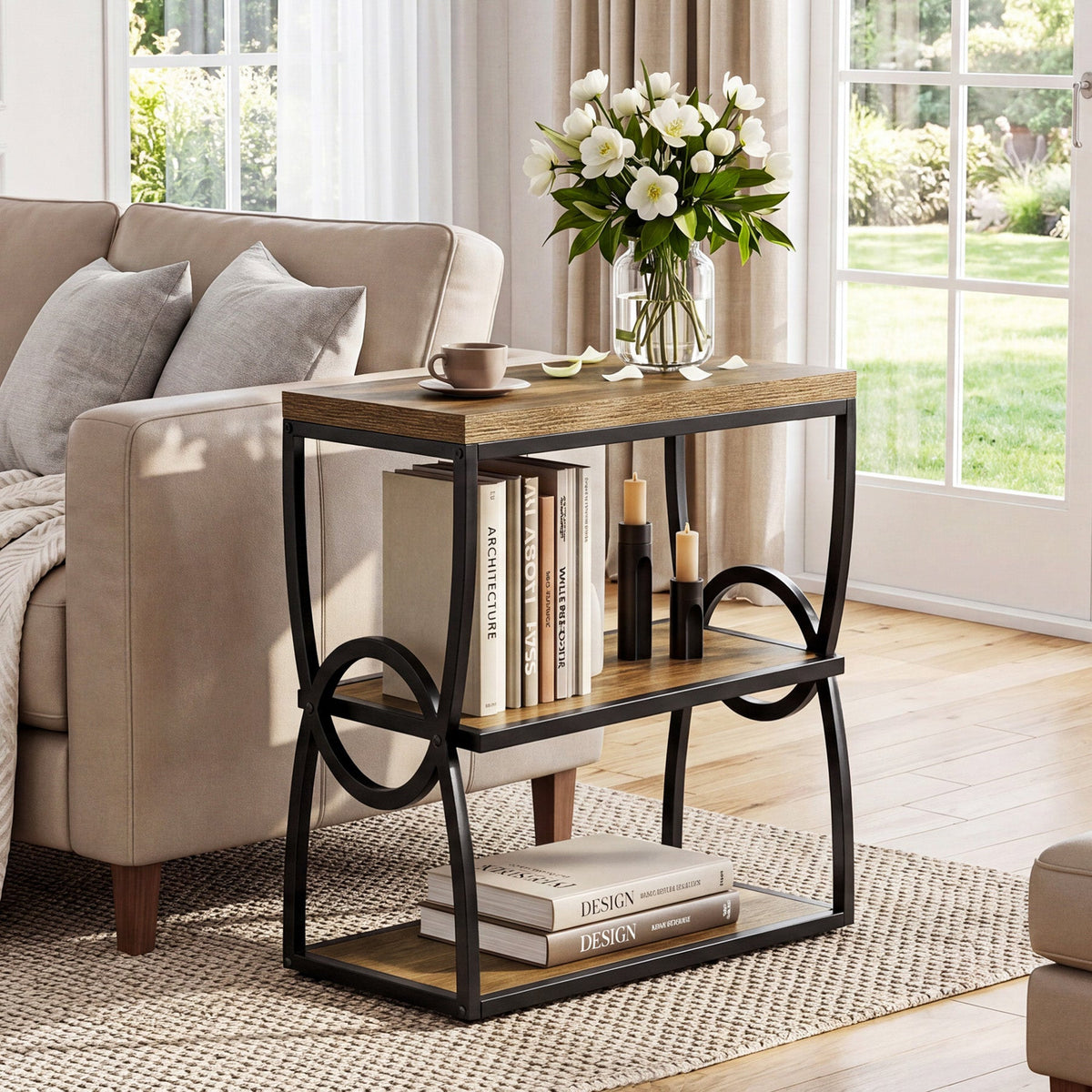 Slim wood and metal side table with flowers beside a sofa