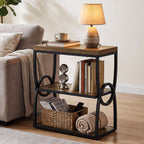 Narrow end table with a lamp and folded throws stored on the lower shelves