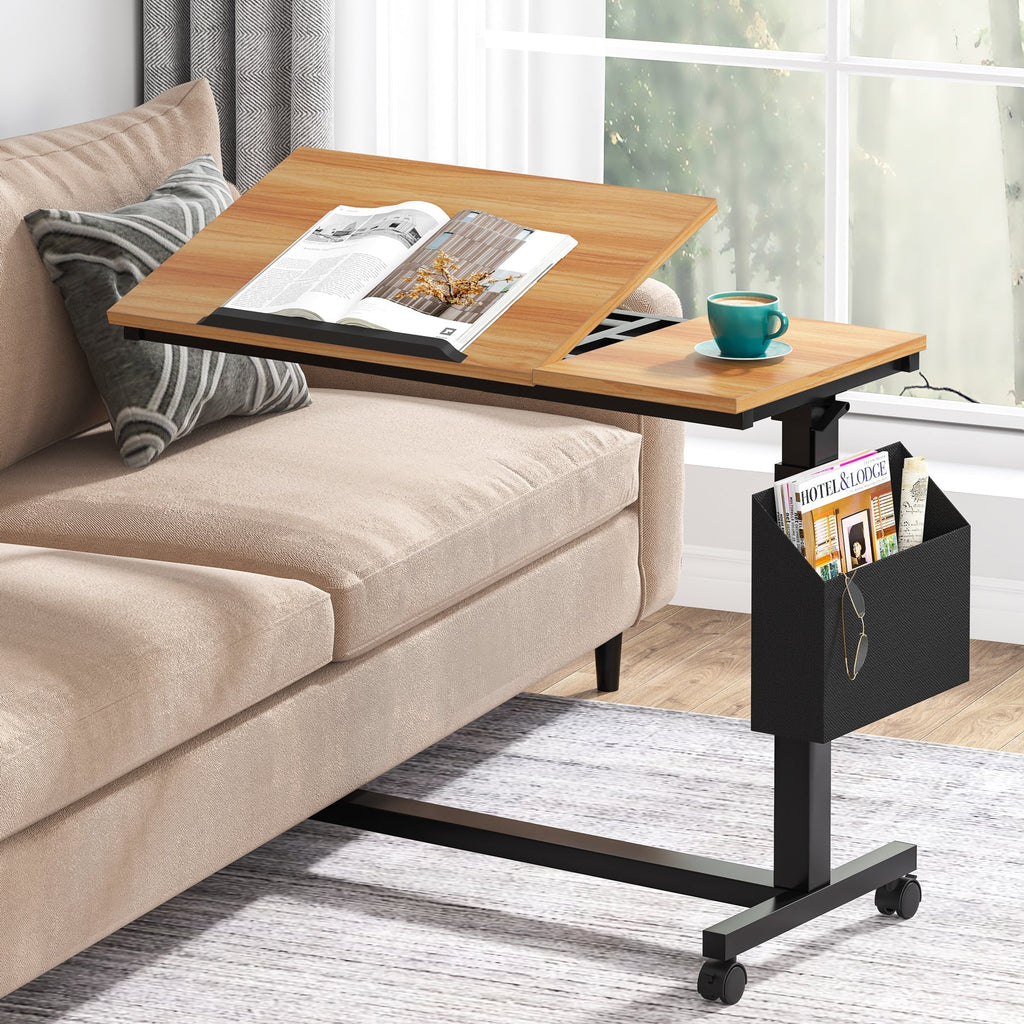Rustic brown mobile C table rolled over a sofa seat, tilting section raised with a magazine on it