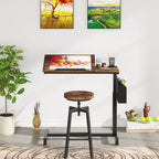 C table at working height beside a stool with plants and jars around it