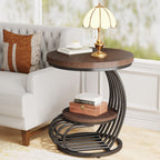 Stowena rustic brown round two tier end table beside a sofa with a lamp