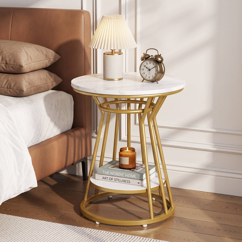 Faux marble table as bedside with lamp, candle and books on two tiers