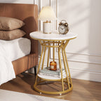 Faux marble table as bedside with lamp, candle and books on two tiers