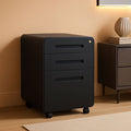 Black 3 drawer mobile file cabinet on casters standing beside a desk in a warm lit home office