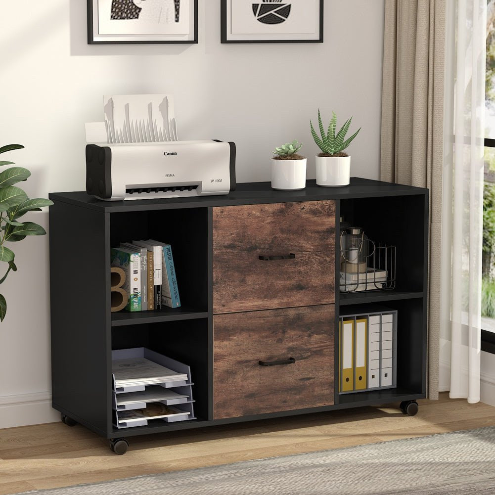 File cabinet under framed art with printer, files and binders in its cubbies