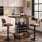 Kitchen island bar with wine bottles and stemware between two leather stools
