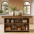 Farmhouse island under arched windows holding a toaster, baskets and kitchen jars