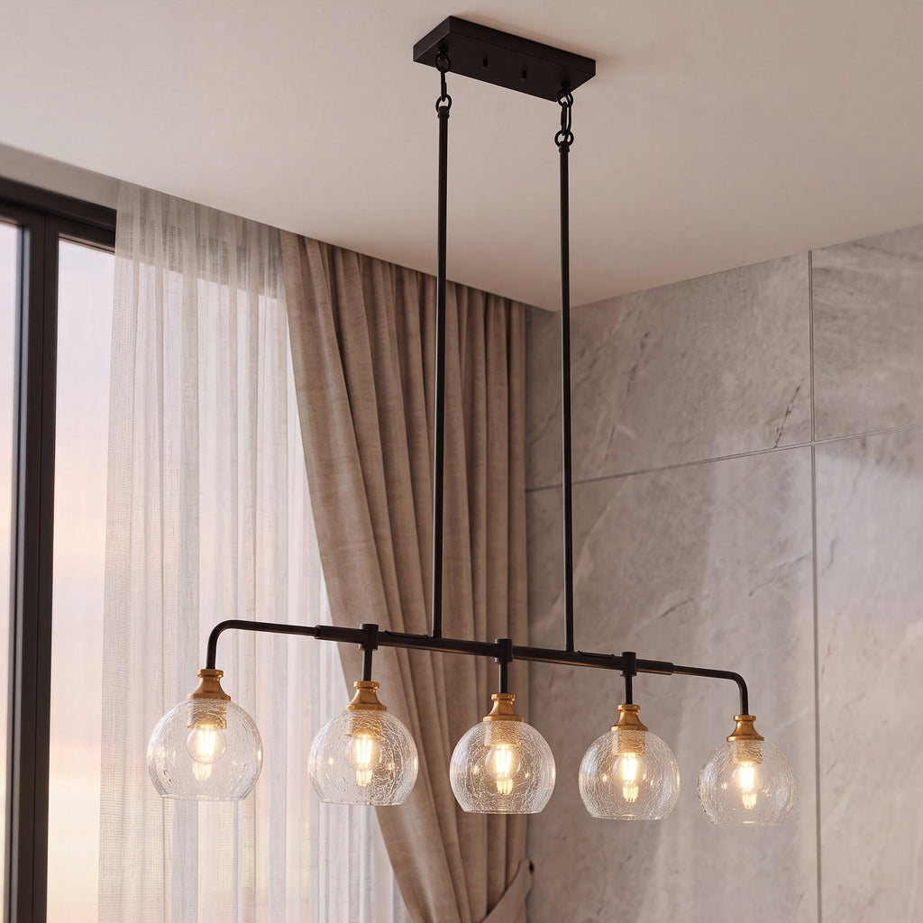 The crackle glass chandelier hanging on long rods beside a curtained window