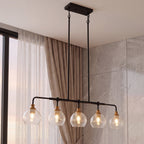The crackle glass chandelier hanging on long rods beside a curtained window