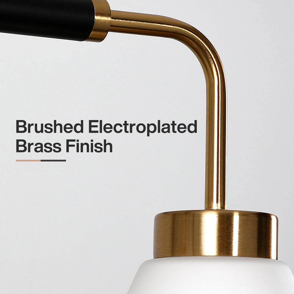 Close view of the brushed brass arm and collar meeting the frosted shade