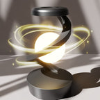 Spiral arm of the gray moon lamp shown mid rotation with light trails