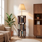 Stowena 62 inch floor lamp with 3 tier bookshelf lit beside an armchair
